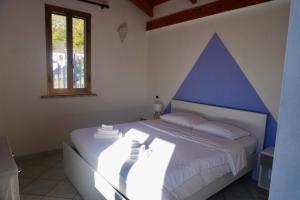 Postel nebo postele na pokoji v ubytování La Cà di Carol + 5 fotografií