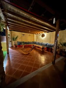 a living room with a couch and a table at Maritsa's Rooms in Stavros