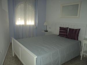 Apartamento Centro Jerez Campillo Iにあるベッド