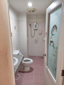 a bathroom with a shower and a toilet and a sink at Town View Hostel - Krabi Town in Krabi town +34 photos