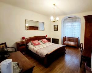 Postel nebo postele na pokoji v ubytování A la Grenouille du Jura