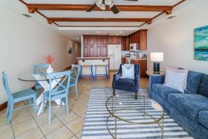 a living room with a couch and a table at The Vue 233 in Tybee Island