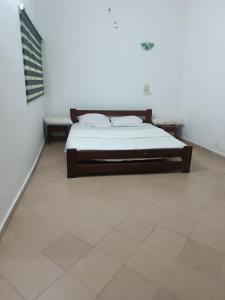 Postel nebo postele na pokoji v ubytování Villa King Ohm ara y + 9 fotografií