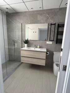 a bathroom with a sink and a shower and a toilet at Villa in Rojales in Rojales