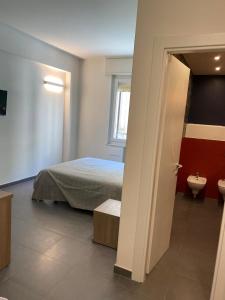 Postel nebo postele na pokoji v ubytování Via Sapri Luxury Rooms and Apartments