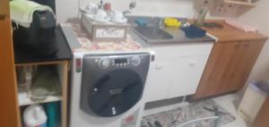 a toy kitchen with a sink and a dishwasher at la casa di ALEX in Rionero in Vulture
