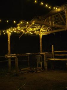 a group of lights on a wooden structure at night at Cloud Wayne in Sultan Bathery