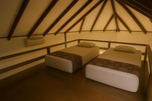 Postel nebo postele na pokoji v ubytování Redang Divers Resort