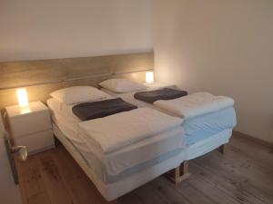 Ένα ή περισσότερα κρεβάτια σε δωμάτιο στο Maison du Port - centre ville - à deux pas de l'arrivée des bateaux