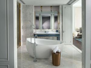 a bathroom with a white tub and a sink at Sofitel Foshan Shunde in Shunde +151 photos