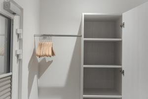 a room with white walls and white shelves at C&M Hotel in Hamburg +7 photos