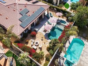 an aerial view of a house with a swimming pool at Luxurious Custom-built Villa Pool Spa Fire Pit more in Palm Desert