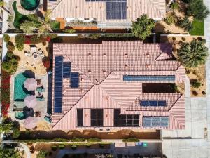 an overhead view of a house with a pink roof at Luxurious Custom-built Villa Pool Spa Fire Pit more in Palm Desert