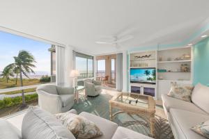 a living room with a view of the ocean at Island Beach Club #340E in Sanibel