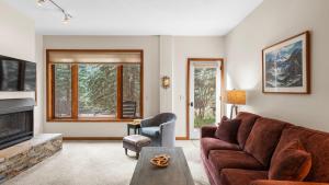 a living room with a couch and a fireplace at Ghostriders 2 by AvantStay Tidy Unit Close to the Slopes and Shops in Telluride