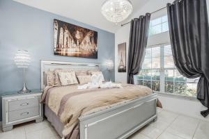 a bedroom with a bed with two stuffed animals on it at Spacious Disney Retreat Lake View Private Pool in Pittsburg +30 photos