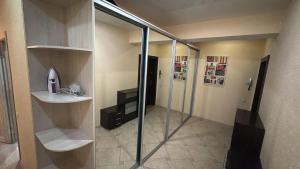 a bathroom with a glass shower and a sink at Wohnung Alter Hof in Künzell +5 photos