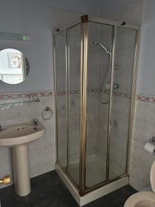 a bathroom with a shower and a sink at ashwood hotel in Preston