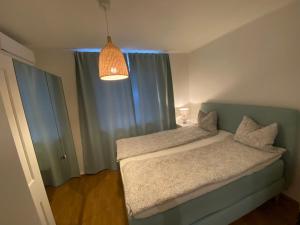 Postel nebo postele na pokoji v ubytování Wohnen bei frau tinz - Apartment - Bahnhof- und Zentrumsnähe