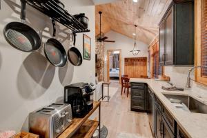 a kitchen with pots and pans hanging on the wall at Banner Bear in Banner Elk