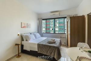 Postel nebo postele na pokoji v ubytování Estúdio no Centro Histórico de PoA | CCF1410