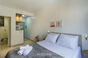 Ένα ή περισσότερα κρεβάτια σε δωμάτιο στο Estúdio no Centro Histórico de PoA | CCF1410