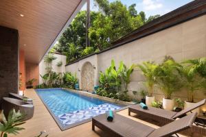an indoor swimming pool in a house at Amankara Canggu in Canggu +43 photos