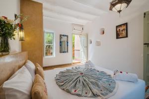 Postel nebo postele na pokoji v ubytování Hôtel Dar 55 - Berber House