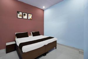 Ένα ή περισσότερα κρεβάτια σε δωμάτιο στο Hotel O Mahlawat +18 φωτογραφίες