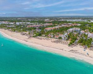 an aerial view of a resort on the beach at SUMMER DREAM STUDIOS DELUXE playa LOS CORALES in Punta Cana +49 photos