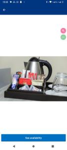 a shelf with a tea pot on top of a stove at Mthembu Executive Accomodation in Standerton