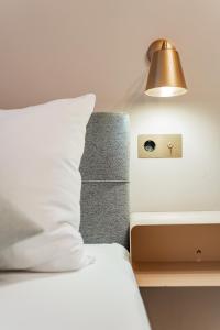 Postel nebo postele na pokoji v ubytování HOME1 - Bloom Boutique Hostel