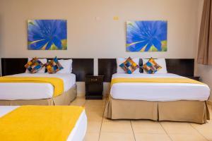 Ένα ή περισσότερα κρεβάτια σε δωμάτιο στο Hotel Residencial Cervantes