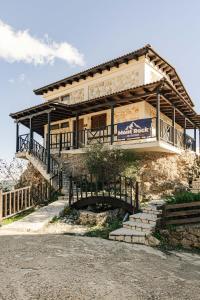 a house on the side of a hill with stairs at Mont Rock in Synikia Mesi Trikalon