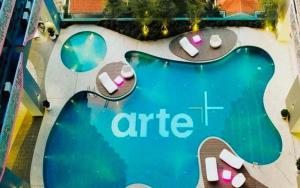 an overhead view of aire sign next to a swimming pool at Arte Plus Luxury Suites with KLCC View in Kuala Lumpur