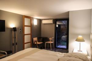 Postel nebo postele na pokoji v ubytování Villa des anémones