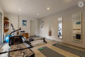 a room with a gym with a treadmill at Coeur de fournache in Saint-Jean-de-Maurienne