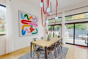 a dining room with a table and chairs at The HUB in Eugene