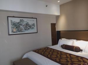 Postel nebo postele na pokoji v ubytování Skyline Plaza Hotel Guangzhou
