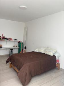 En eller flere senge i et værelse på Beach house - Alto Bujama Condominium