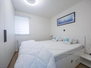 Ένα ή περισσότερα κρεβάτια σε δωμάτιο στο 't Zand - 2 + park. 2