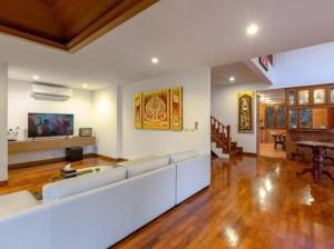 a living room with a white couch and a table at Patong Hill Estate 6 in Patong Beach