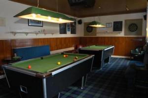 a billiard room with two pool tables in a room at The Imperial Hotel in Castle Douglas