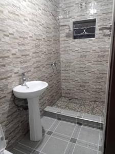 Koupelna v ubytování Savwa Lodges and Apartments + 19 fotografií