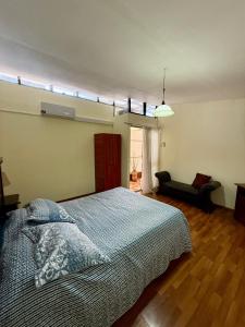 Giường trong phòng chung tại Casa Luz +7 ảnh