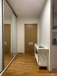 an empty room with a desk and a door at 2 room apartment in Pasila in Helsinki