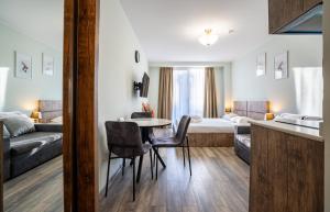 Giường trong phòng chung tại New Gudauri, Loft 1 Apartment