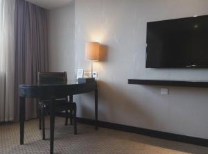 TV a/nebo společenská místnost v ubytování Skyline Plaza Hotel Guangzhou
