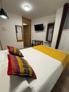 Postel nebo postele na pokoji v ubytování CASA CRISTOBAL Centenario