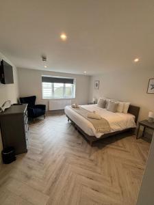 Ένα ή περισσότερα κρεβάτια σε δωμάτιο στο Bay View